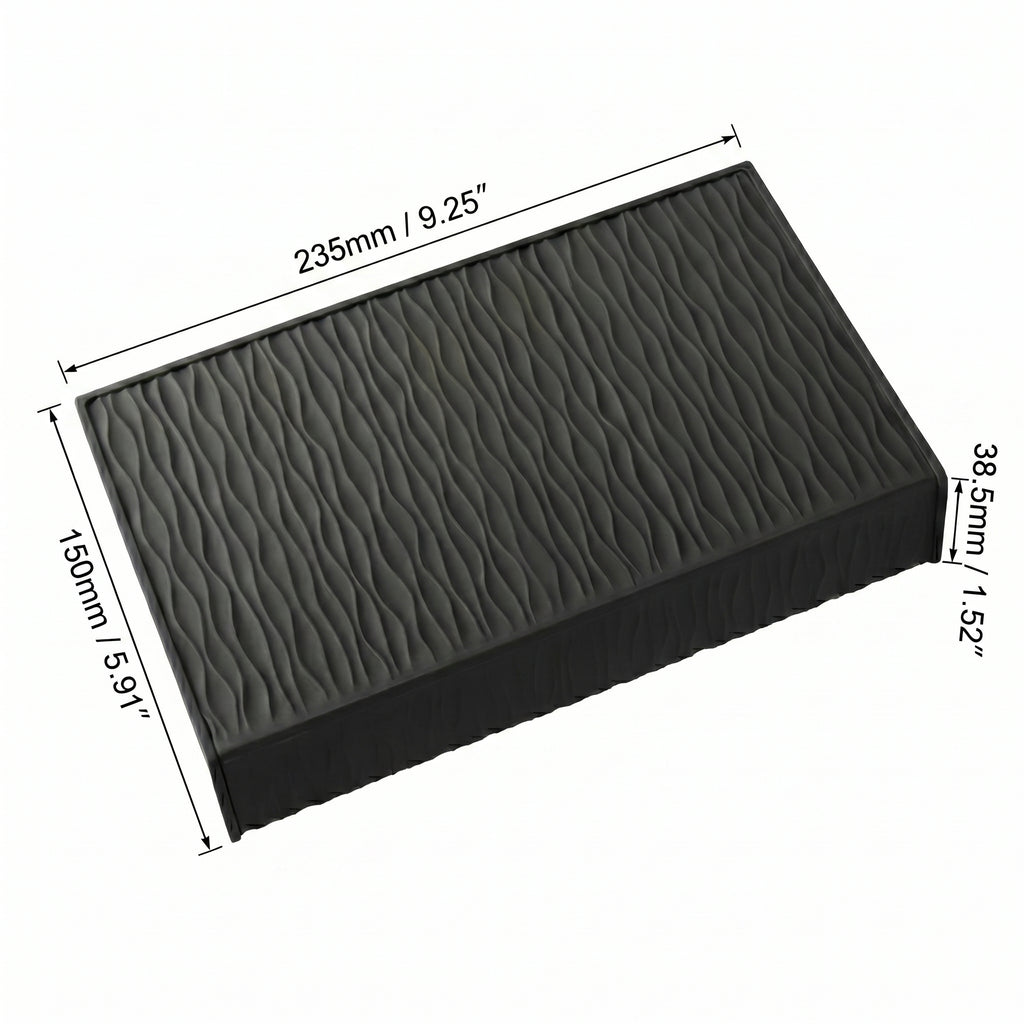 Technical scale layout showing the millimetric width and counter lip depth of the extended obsidian black silicone tamping station.