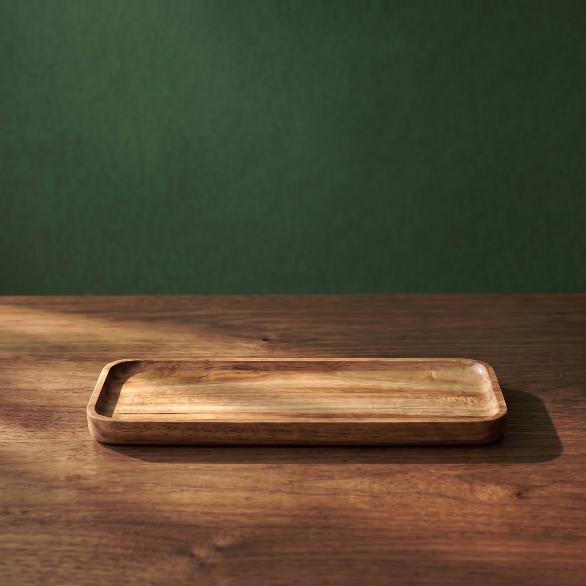 Medium-sized Vance beveled walnut wood tray featuring natural grain patterns and elegant sloped edges, illuminated by warm ambient light.