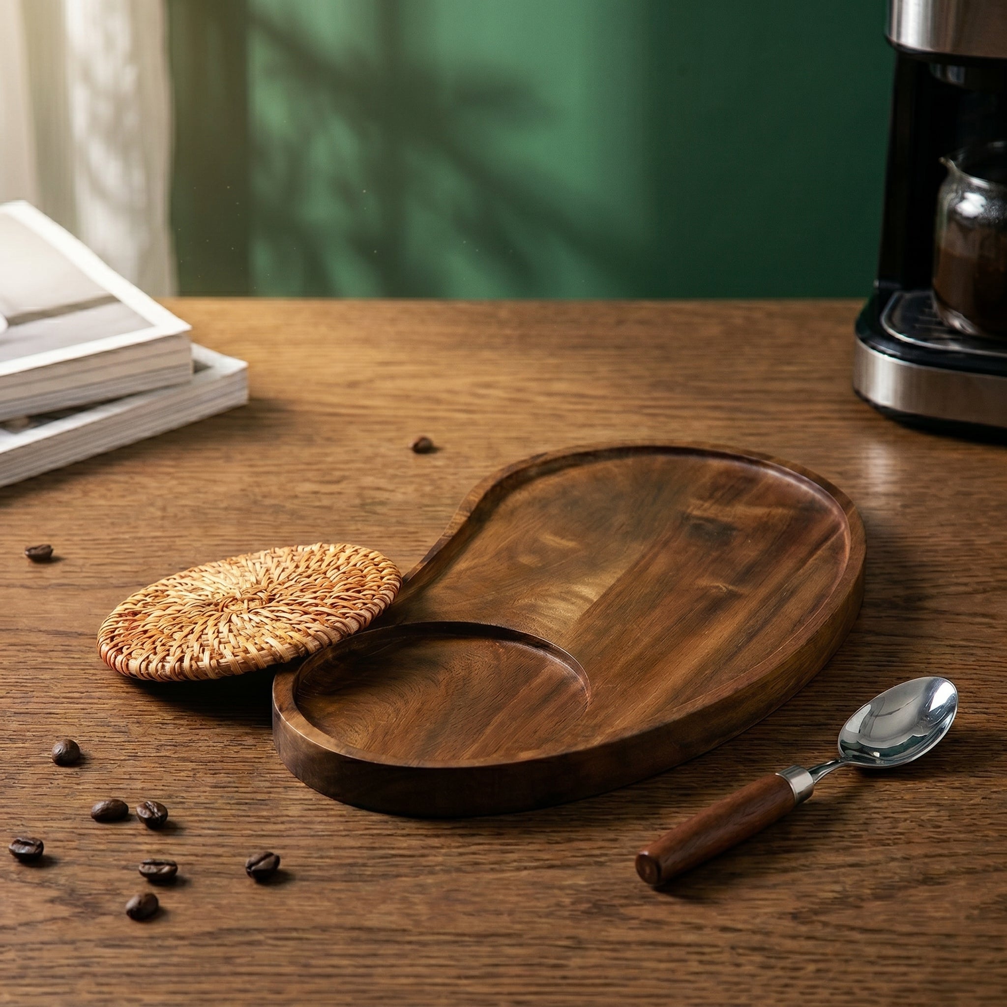 The Winston asymmetric wood serving tray styled with a woven rattan coaster and a timber-handled spoon on an oak coffee bar counter.